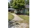 Quaint home featuring a landscaped yard and a charming walkway to the front porch at 209 E Winston St, Youngsville, NC 27596