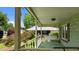 Covered porch with a porch swing and a view of the front yard at 209 E Winston St, Youngsville, NC 27596