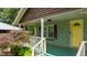 Covered front porch with a swing and view of the front yard, adding a relaxing outdoor space to the home at 209 E Winston St, Youngsville, NC 27596
