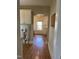 Hallway features an arched doorway and wood look flooring at 209 E Winston St, Youngsville, NC 27596