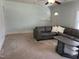Cozy living room with a large sectional sofa and ample natural light at 209 E Winston St, Youngsville, NC 27596