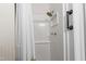 Shower featuring a shower head, grab bar, and soap dish at 209 E Winston St, Youngsville, NC 27596