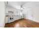 Open kitchen features hardwood floors, white appliances, ample cabinet space, and natural light at 212 Northwood Cir, Durham, NC 27701