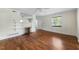Spacious living room features hardwood floors, a fireplace, and ample natural light from a window at 212 Northwood Cir, Durham, NC 27701