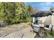 Spacious backyard featuring a wooden deck with an umbrella-covered table, perfect for outdoor dining at 214 Northwood Cir, Durham, NC 27701