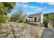 View of the backyard with a spacious deck, some grass and a gravel area at 214 Northwood Cir, Durham, NC 27701