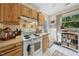 Functional kitchen with wooden cabinets, ample counter space, and modern appliances at 214 Northwood Cir, Durham, NC 27701