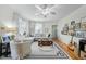 Bright and spacious living room featuring hardwood floors, abundant natural light, and comfortable seating at 214 Northwood Cir, Durham, NC 27701