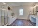 Bright bathroom with window, and separate shower and tub at 215 Graduate Ct, Durham, NC 27713
