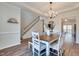 This dining area offers a seamless transition to the staircase and an abundance of natural light at 215 Graduate Ct, Durham, NC 27713