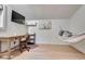 Outbuilding interior features wood floors, a TV, a desk, and a comfy hammock at 215 Graduate Ct, Durham, NC 27713