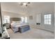 Spacious primary bedroom with lots of natural light, neutral palette, and comfortable carpeting at 215 Graduate Ct, Durham, NC 27713
