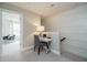 Home office off the landing features board and batten accent wall and a writing desk at 2301 Bay Minette Sta # 538, Apex, NC 27502