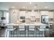 Modern kitchen boasts stainless appliances, white cabinets, pendant lighting and a large marble island with barstool seating at 2301 Bay Minette Sta # 538, Apex, NC 27502