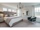 Spacious main bedroom with large windows, accent wall and a sitting area at 2301 Bay Minette Sta # 538, Apex, NC 27502