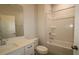 Bathroom with a tiled floor, tub, shower, toilet, and vanity with a sink at 2323 Hunter Woods Dr # 566, Apex, NC 27502