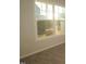 Bedroom with neutral colored walls, carpet, and a large window with natural light at 2323 Hunter Woods Dr # 566, Apex, NC 27502