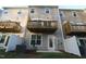 Exterior view featuring a deck on each unit, neutral siding, and a small backyard at 2323 Hunter Woods Dr # 566, Apex, NC 27502