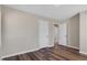 Bedroom featuring wood-look floors, a ceiling fan, and closet space, with natural light from a window at 2624 Gary Rd, Rocky Mount, NC 27803