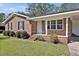 Charming brick home with a manicured lawn, complemented by dark shutters and a welcoming front porch at 2624 Gary Rd, Rocky Mount, NC 27803