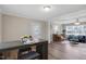 Inviting living room features wood-look floors and neutral paint, flowing into a cozy sitting room with piano at 2624 Gary Rd, Rocky Mount, NC 27803