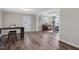 Open floor plan seamlessly connects the dining area with the living room and its inviting piano at 2624 Gary Rd, Rocky Mount, NC 27803