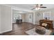 Open living space with wood-look floors leading into a sitting area with a piano and an adjacent table at 2624 Gary Rd, Rocky Mount, NC 27803