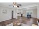 Open living area boasts wood-look floors and views into the updated kitchen with stainless appliances at 2624 Gary Rd, Rocky Mount, NC 27803