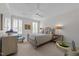 Bright, open bedroom featuring natural light, ceiling fan and neutral color palette at 2701 Glenwood Gardens Ln, Raleigh, NC 27608