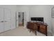 Comfortable home office with wood desk and chair in a naturally lit room at 2701 Glenwood Gardens Ln, Raleigh, NC 27608
