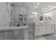 Spacious main bathroom showcases a walk-in shower, marble countertops, and modern fixtures; refined and functional at 2701 Glenwood Gardens Ln, Raleigh, NC 27608