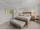 Comfortable main bedroom with a king bed, en-suite bathroom access, and stylish furnishings; a cozy sanctuary at 2701 Glenwood Gardens Ln, Raleigh, NC 27608