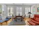 Bright sitting area with shuttered windows and stylish furniture, creating a cozy space to relax at 2701 Glenwood Gardens Ln, Raleigh, NC 27608