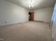 Spacious bedroom featuring neutral carpet, chandelier lighting, and fresh paint at 2710 Delaney Dr, Burlington, NC 27215
