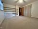 Bedroom features built-in shelving, closet, and neutral carpet at 2710 Delaney Dr, Burlington, NC 27215