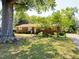 Charming brick home with well-maintained landscaping, mature shade trees, and inviting curb appeal at 2710 Delaney Dr, Burlington, NC 27215