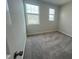 Bedroom with two windows providing lots of natural light at 2723 Hunter Woods Dr # 566, Apex, NC 27502
