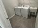 Laundry room features a utility sink and appliances at 2723 Hunter Woods Dr # 566, Apex, NC 27502