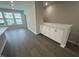 Bright living area featuring wood floors, a large window, and built-in cabinets at 2723 Hunter Woods Dr # 566, Apex, NC 27502