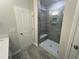 Bathroom showcasing the glass shower with a built-in seat at 2723 Hunter Woods Dr # 566, Apex, NC 27502
