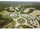 Aerial view of community featuring a pool, sports courts, golf course, and residential homes at 277 High Ridge Ln, Pittsboro, NC 27312