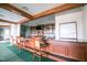 Features a cozy bar area with wooden accents and a well-stocked counter, perfect for relaxation at 277 High Ridge Ln, Pittsboro, NC 27312