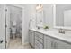 Bathroom with dual sinks, tile floor, separate toilet room, and modern accents at 277 High Ridge Ln, Pittsboro, NC 27312