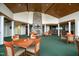 Spacious clubhouse with stone fireplace, bar, and multiple tables for community gatherings and entertainment at 277 High Ridge Ln, Pittsboro, NC 27312