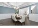 Dining room featuring a decorative ceiling, hardwood floors, and ample seating with stylish, neutral-colored chairs at 277 High Ridge Ln, Pittsboro, NC 27312