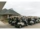 Golf carts parked outside the clubhouse for a convenient golf experience for community members at 277 High Ridge Ln, Pittsboro, NC 27312