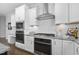 Gourmet kitchen with granite counters, stainless appliances, white cabinetry, and gas cooktop at 277 High Ridge Ln, Pittsboro, NC 27312
