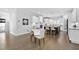 Bright kitchen and breakfast nook area featuring hardwood flooring, a glass table and chairs at 277 High Ridge Ln, Pittsboro, NC 27312