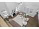 Spacious living room with fireplace, large windows, ceiling fan, and hardwood floors at 277 High Ridge Ln, Pittsboro, NC 27312