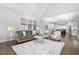 Open-concept living area showcasing a fireplace, neutral decor, and seamless flow into the kitchen at 277 High Ridge Ln, Pittsboro, NC 27312